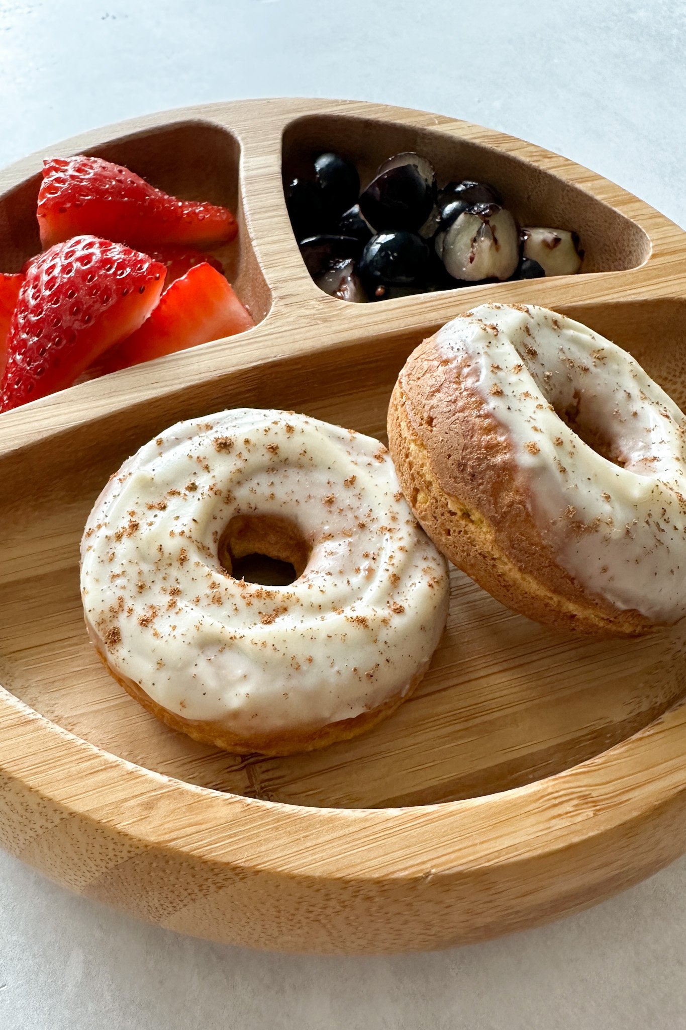 Mini pumpkin donuts served with berries.