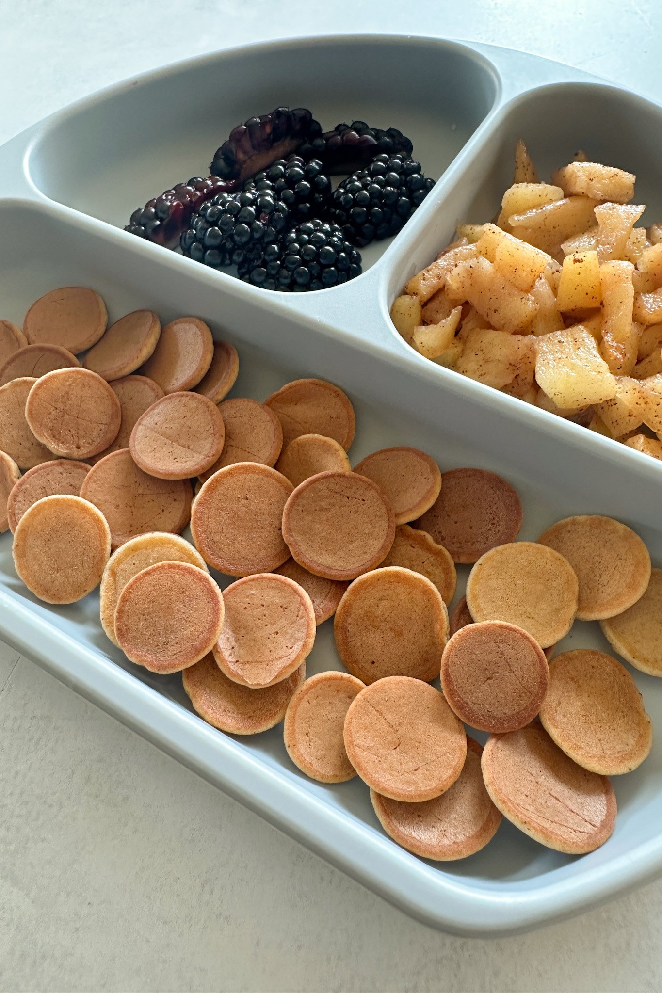 Apple flavored pancake cereal served with fruits.