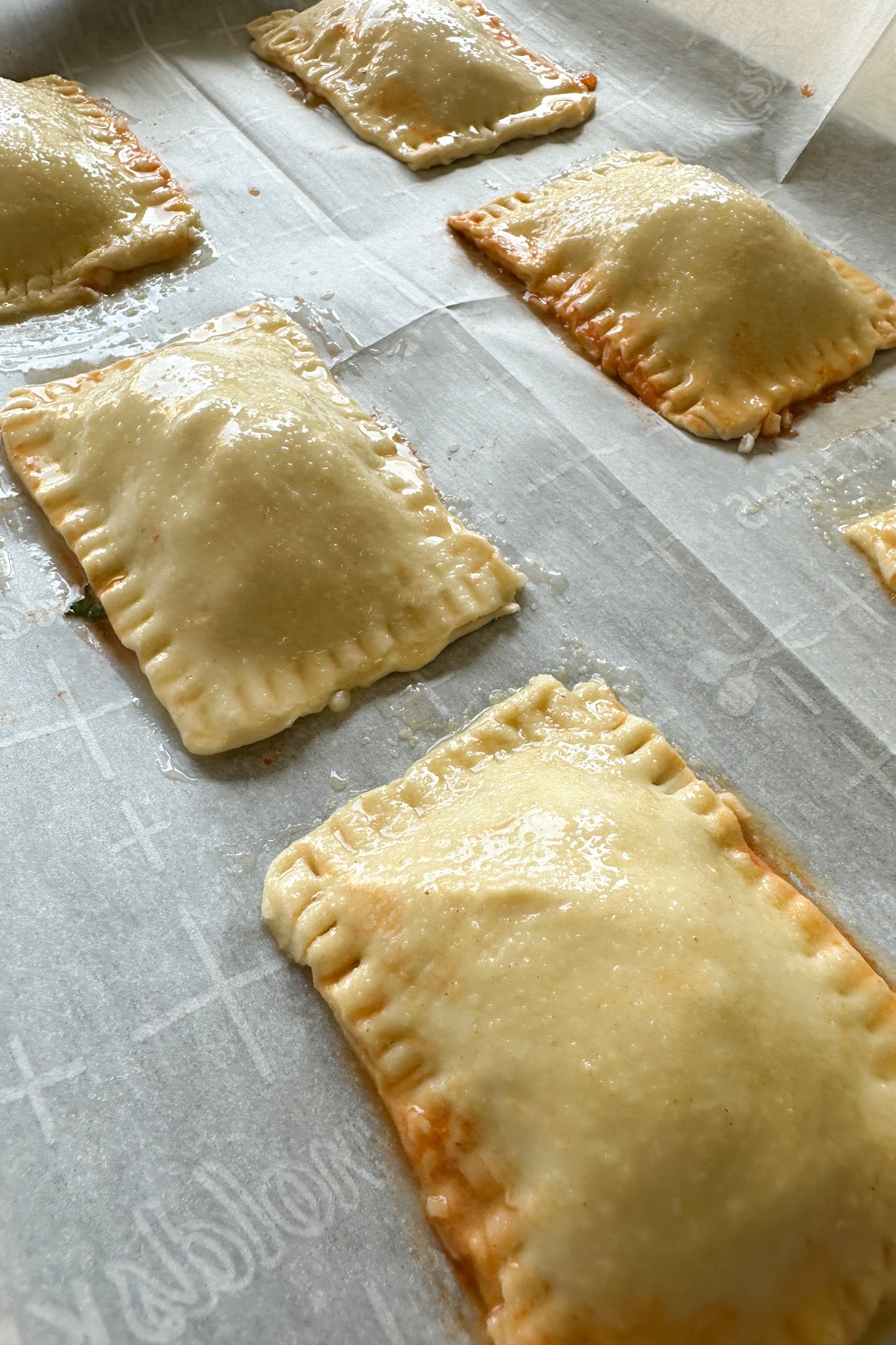 Puff pastry pizza pockets ready to bake.