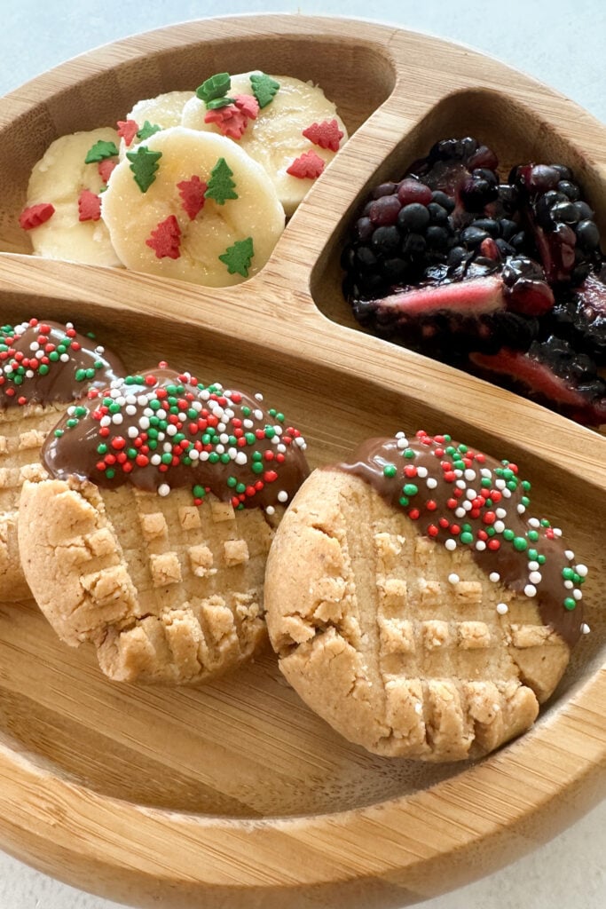 Almond flour peanut butter cookies served with fruits.