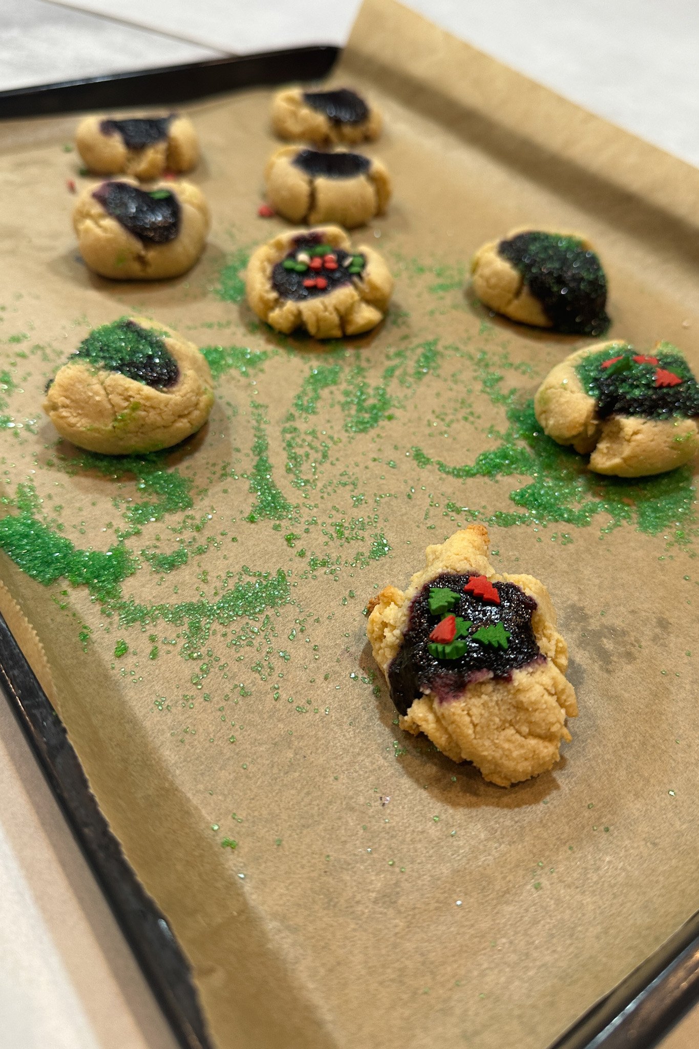 Toddler decorated thumbprint cookies.