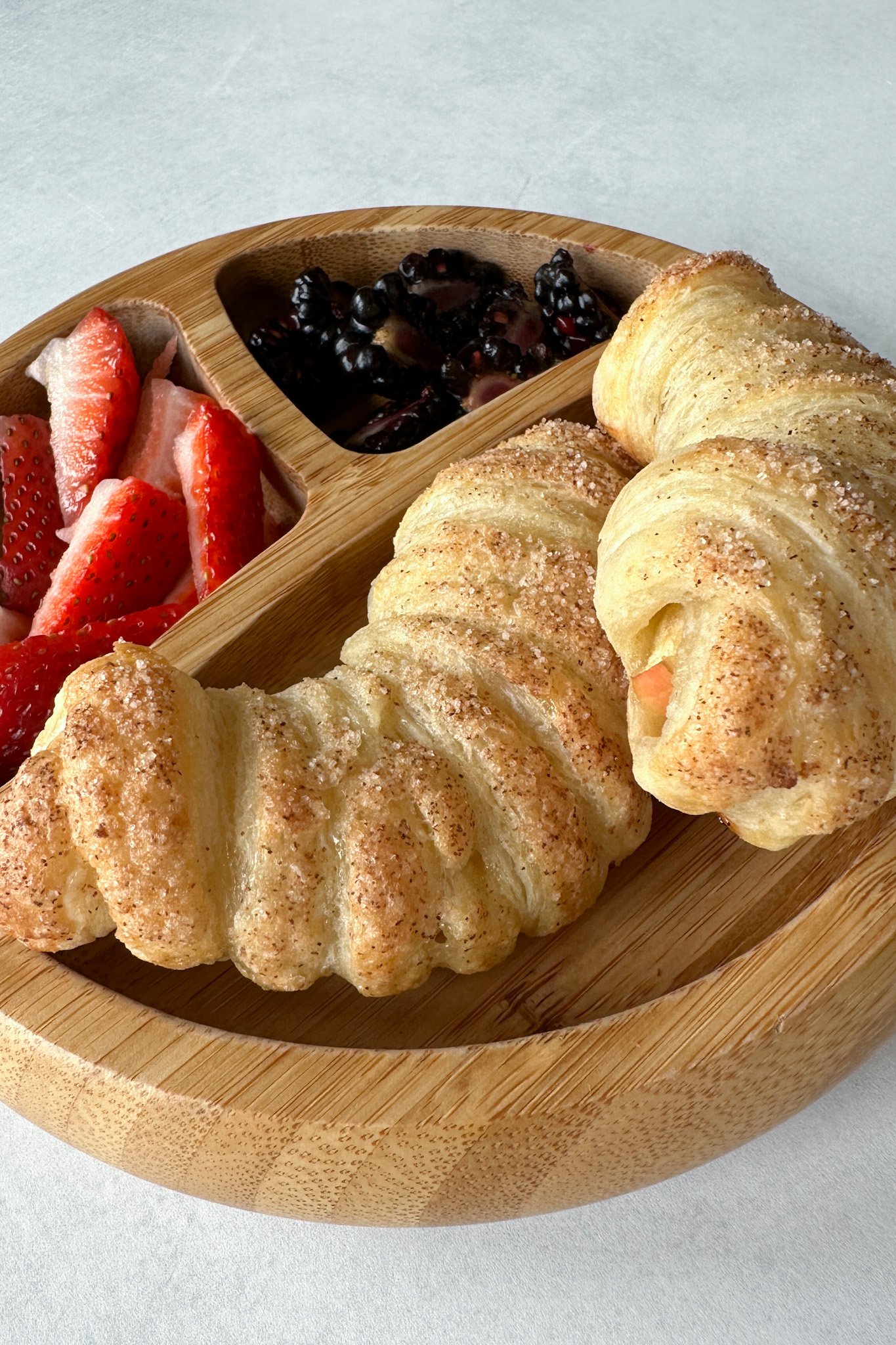 Apple croissants served with berries.