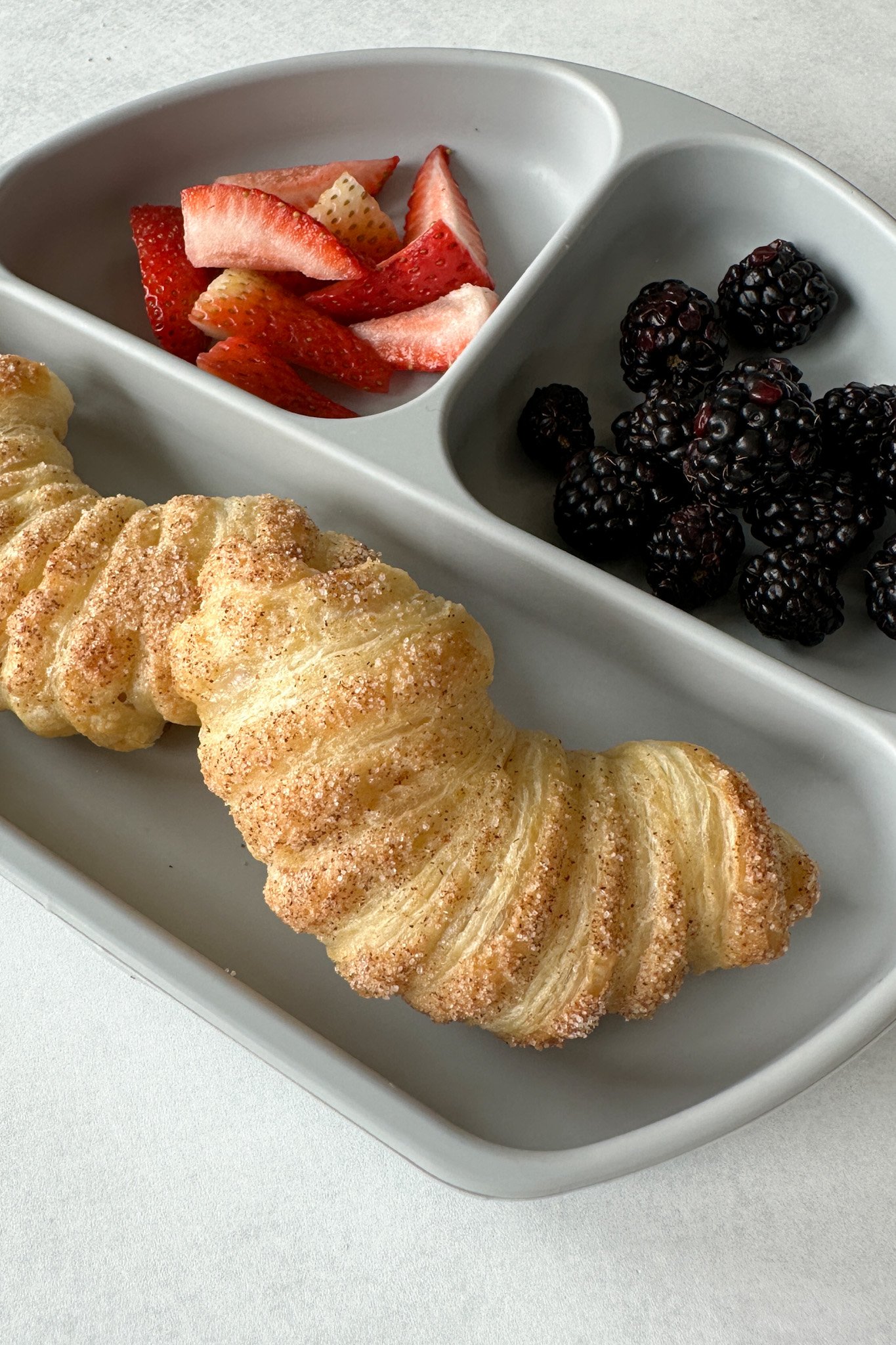 Apple croissants served with berries.