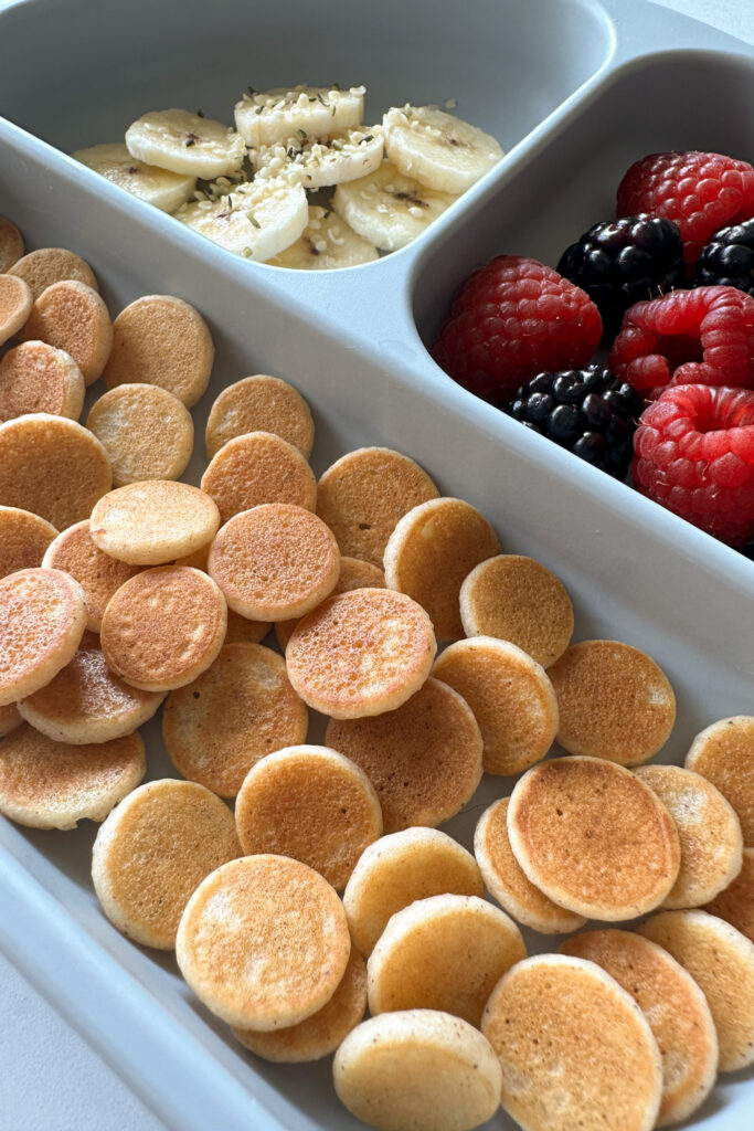 Egg free pancake cereal served with fruits.