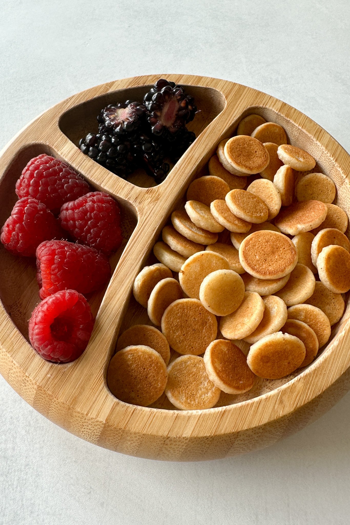Egg free pancake cereal served with fruits.