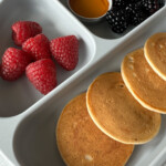 Egg free pancakes served with fruits.