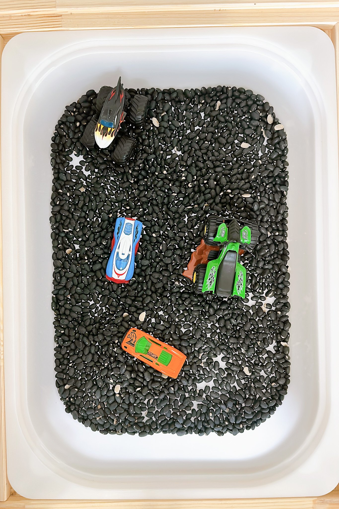 Gravel trucks activity with Ikea Flisat table.