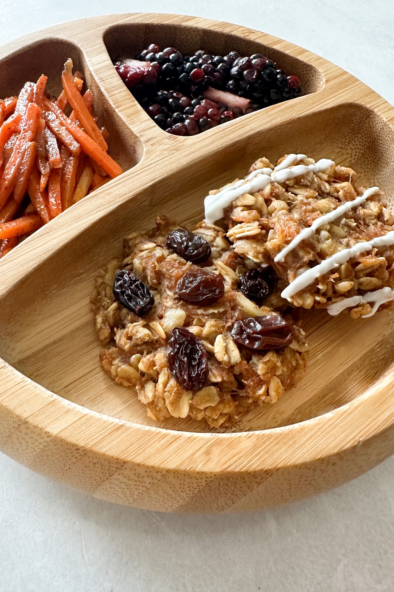 Carrot cake oatmeal cookies served with sauteed cinnamon carrots and blackberries.