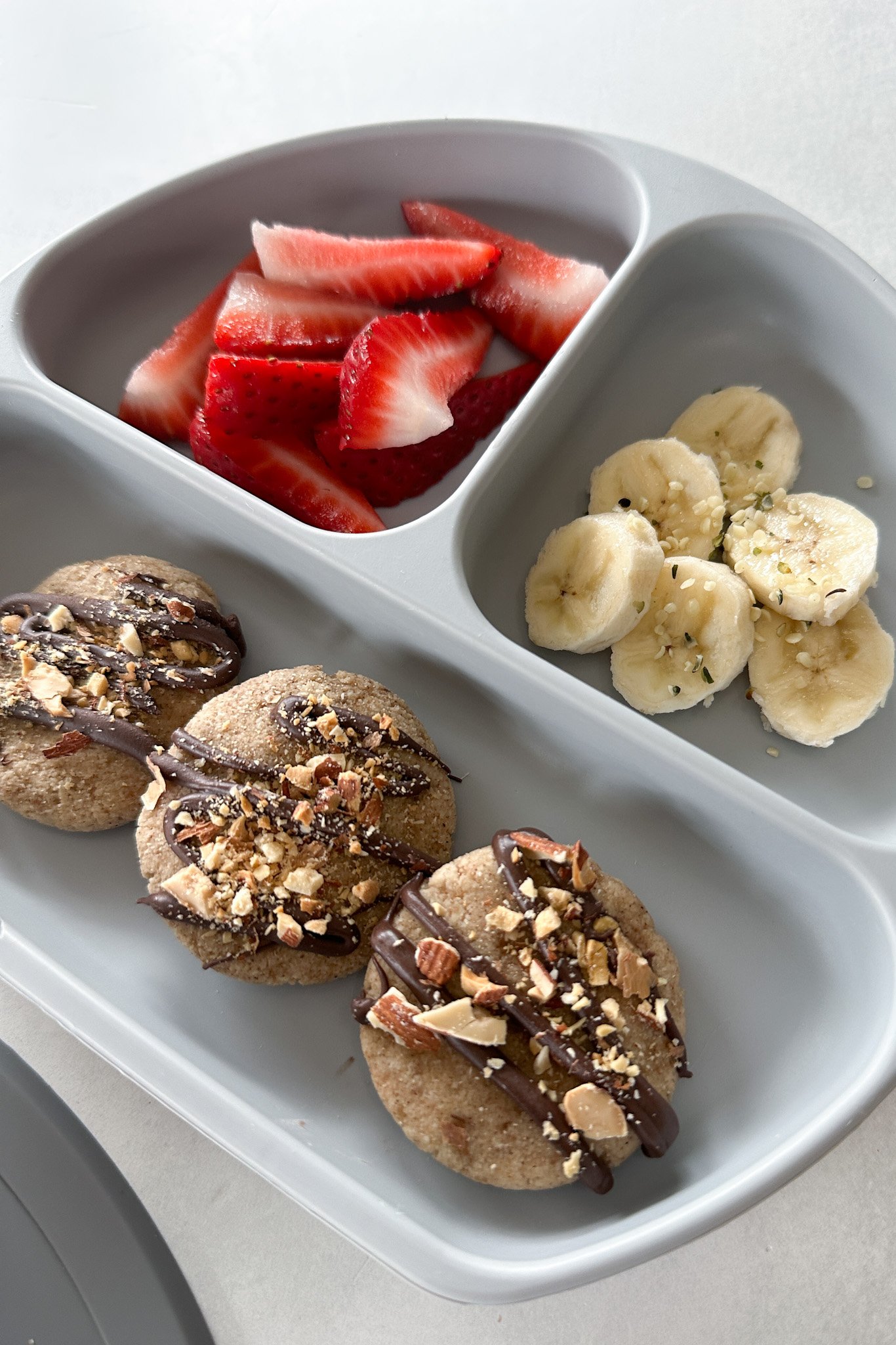 Banana bread cookies served with strawberries.