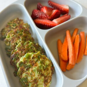 Green bean fritters served with strawberries and carrots.