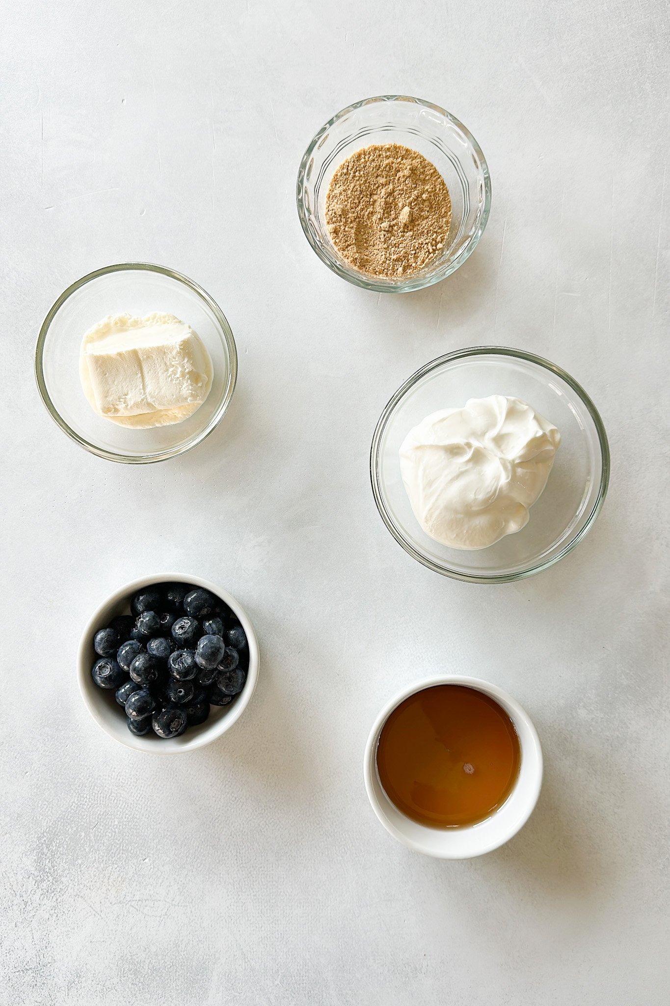 Ingredients to make blueberry cheesecake popsicles.