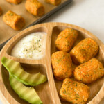 Sweet potato zucchini tots served with avocado and yogurt.