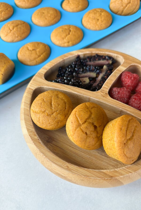 Mini pumpkin muffins served with fruits.