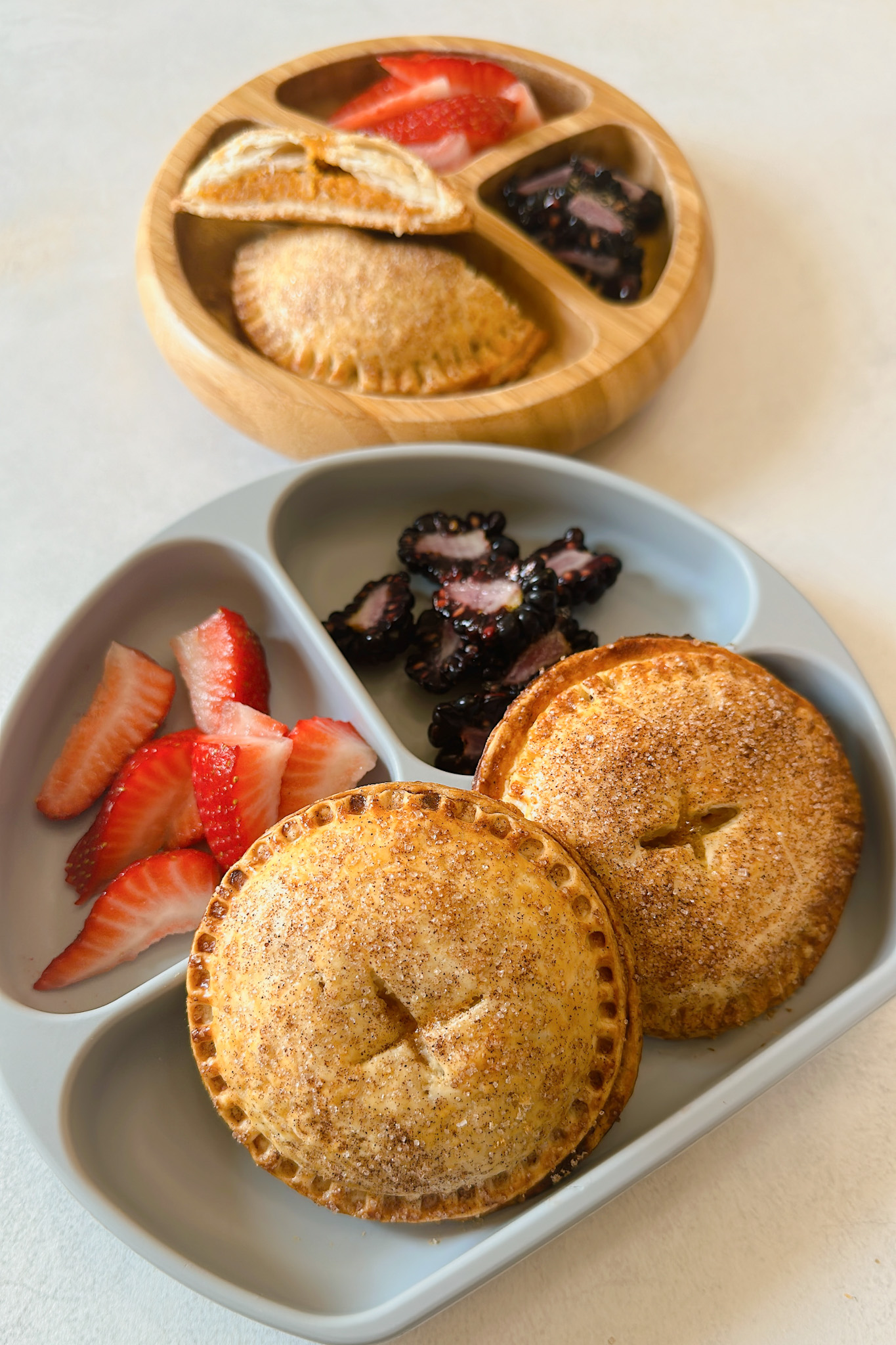 Sweet potato hand pies served with strawberries and blackberries.