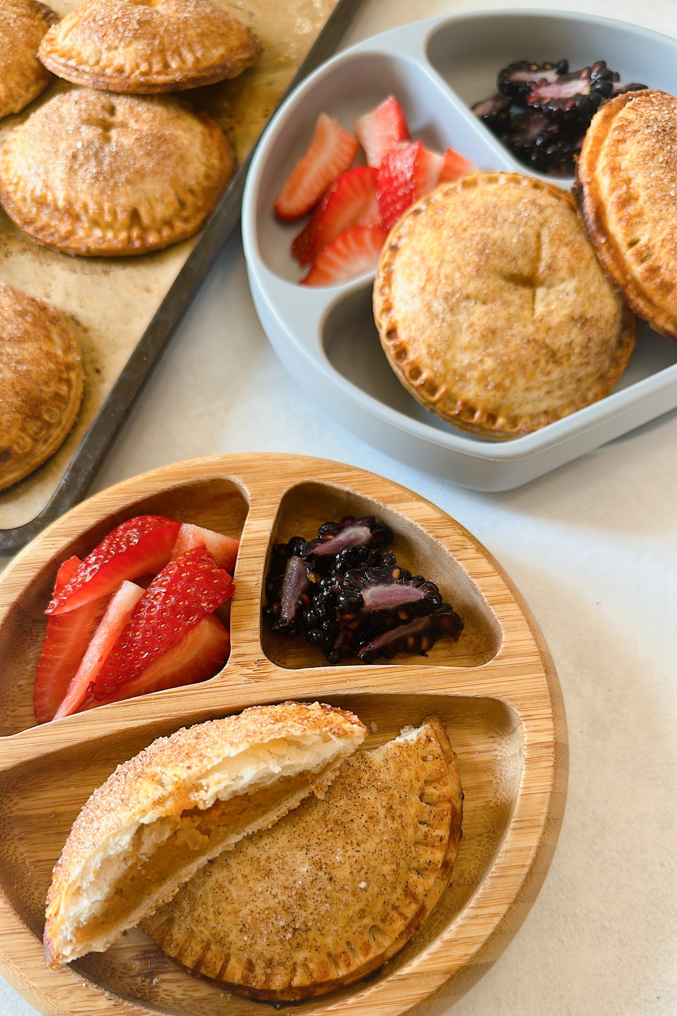 Sweet potato hand pies served with strawberries and blackberries.