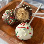 Christmas cake bites on a wooden plate.