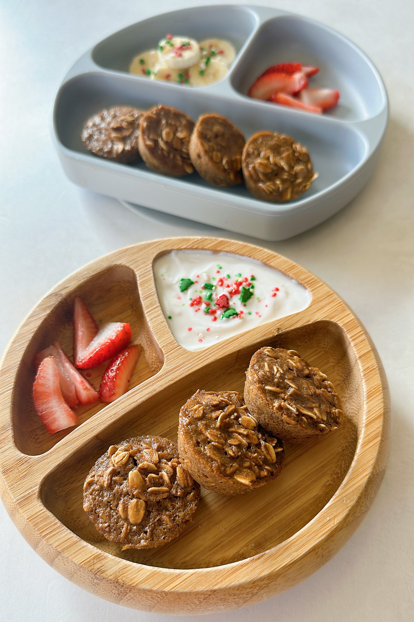 Gingerbread baked oatmeal bites served with strawberries, yogurt, and bananas.