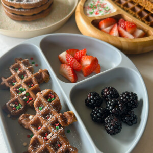 Gingerbread waffles served with yogurt, strawberries and blackberries.