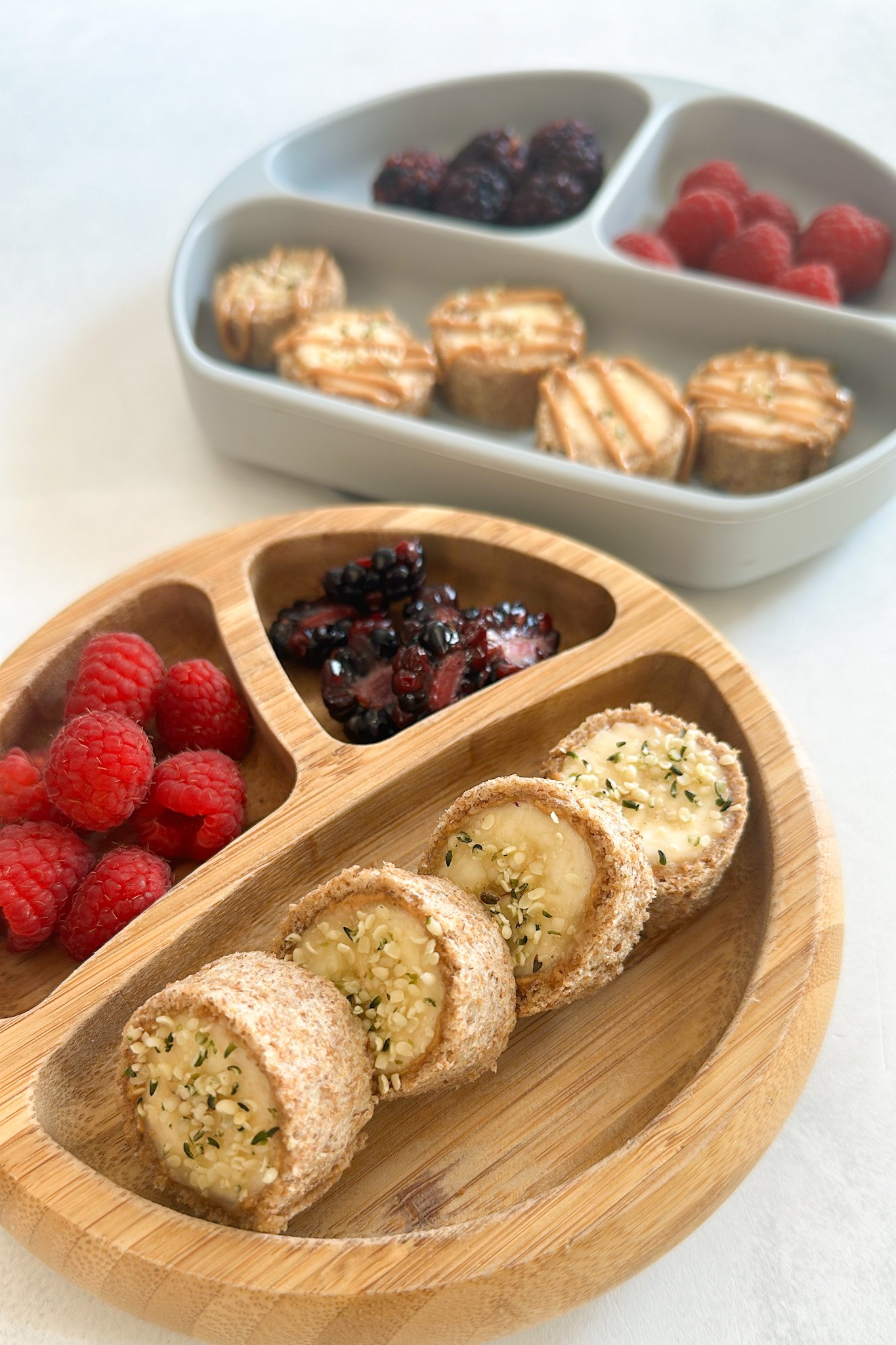 Banana sushi rolls served with berries.