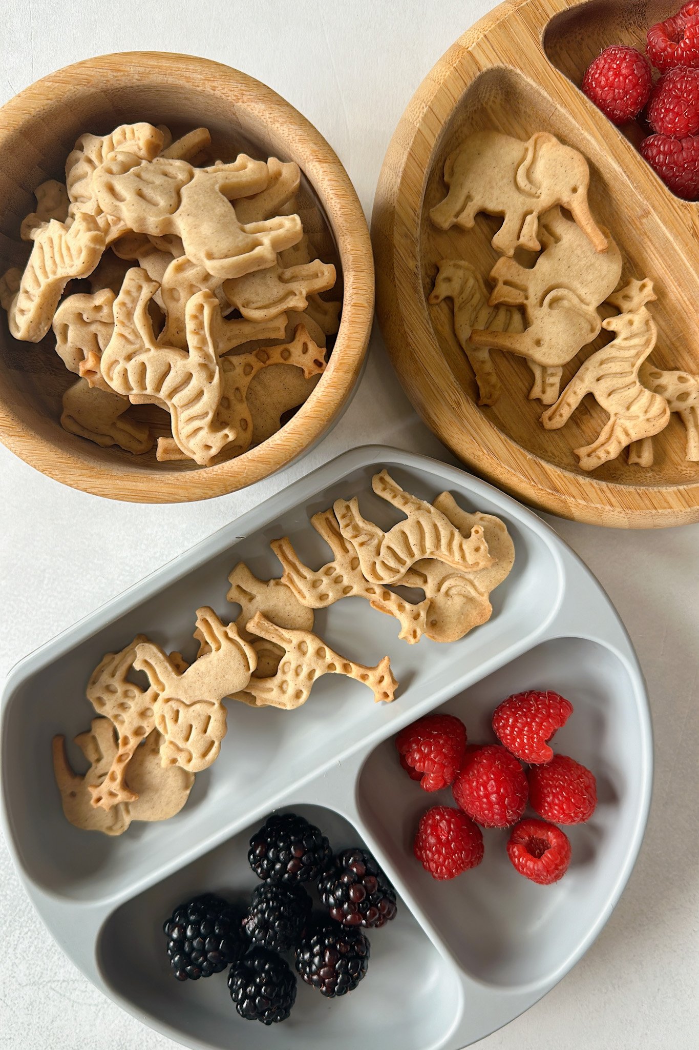 Animal crackers served with blackberries and raspberries.