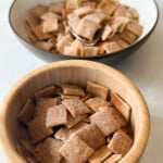 Homemade cinnamon toast crunch cereal served in a bowl.