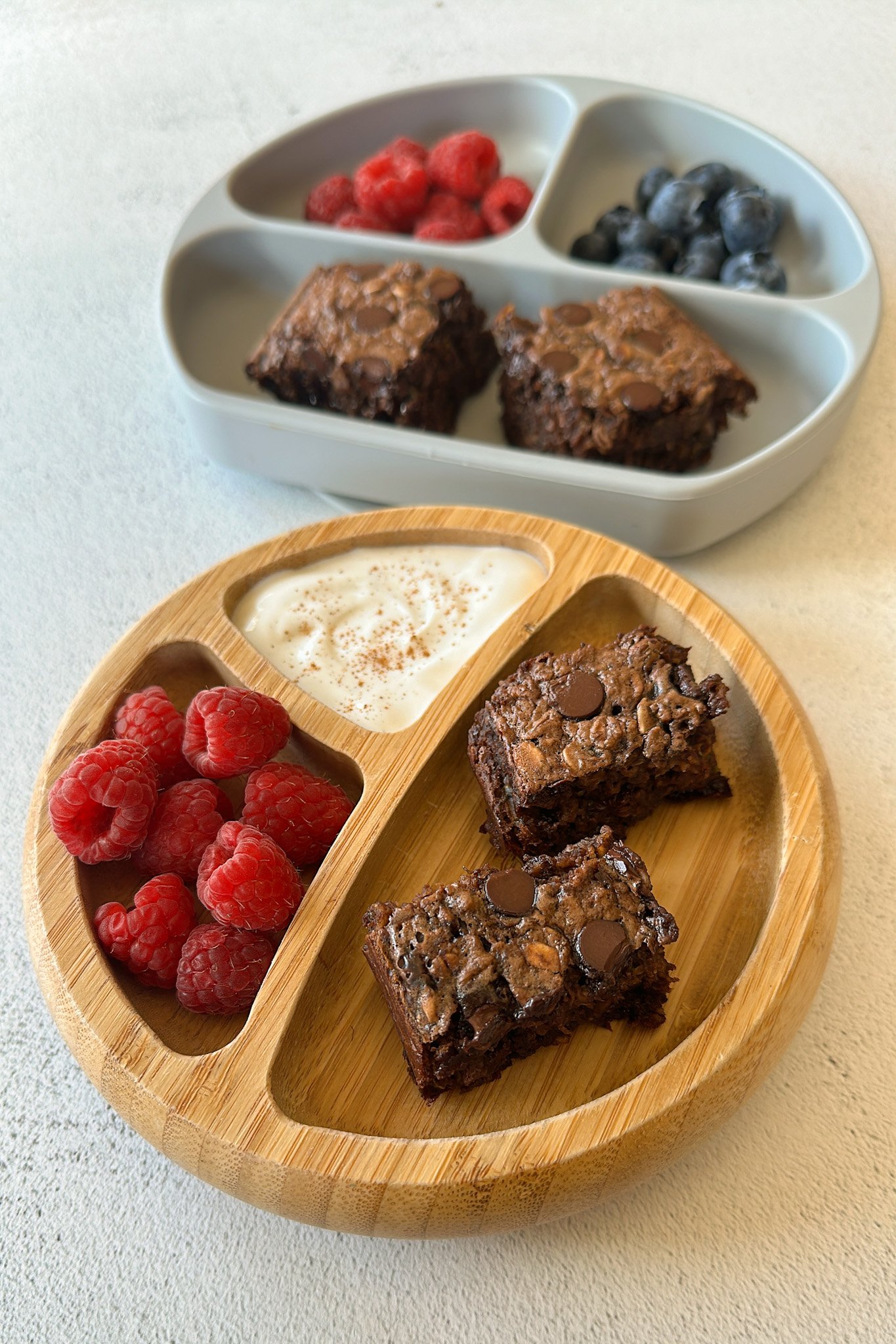 Chocolate baked oatmeal served with berries and yogurt.
