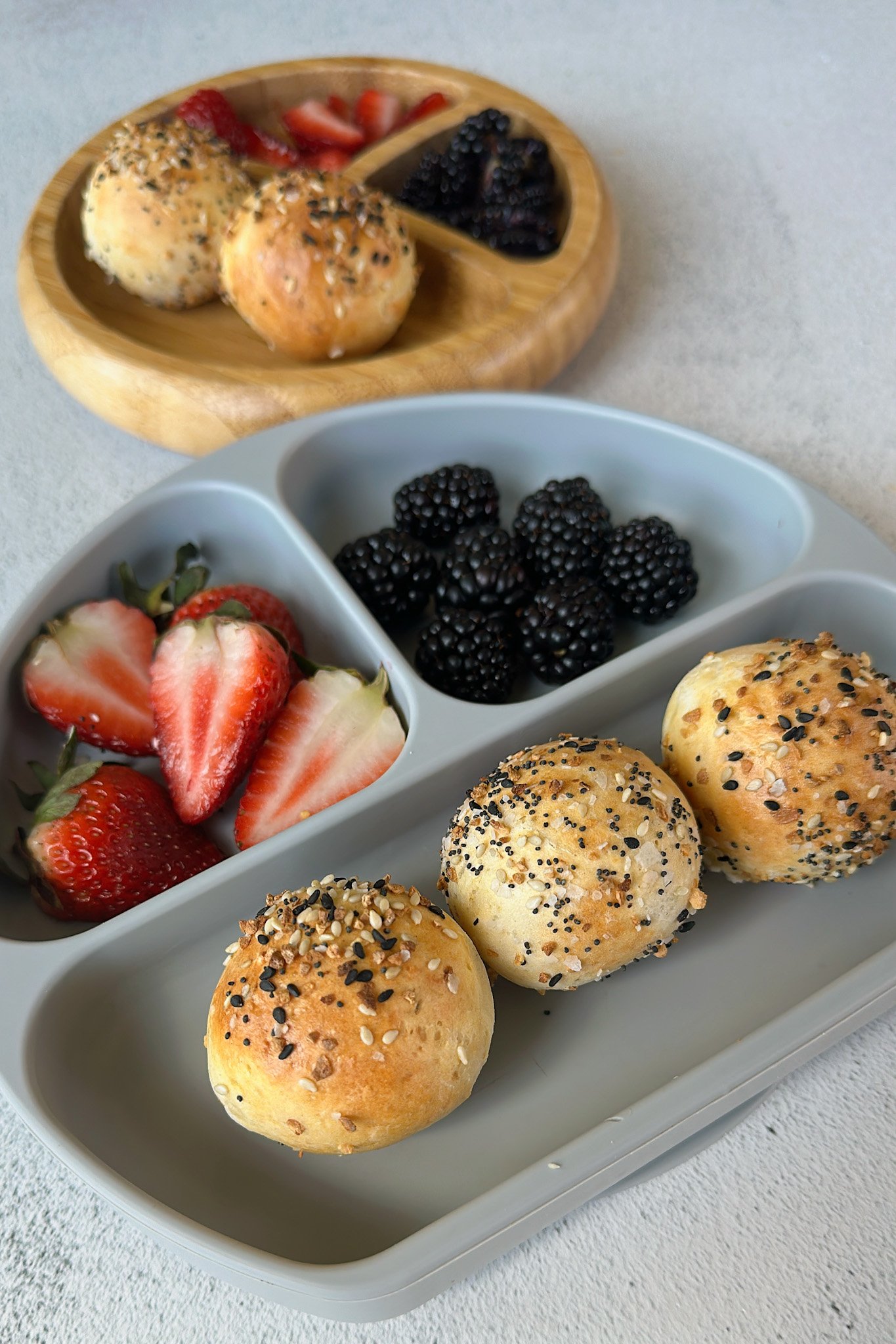 Everything bagel bites served with berries.
