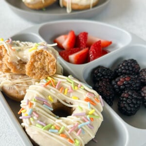Baked carrot cake donuts served with berries.