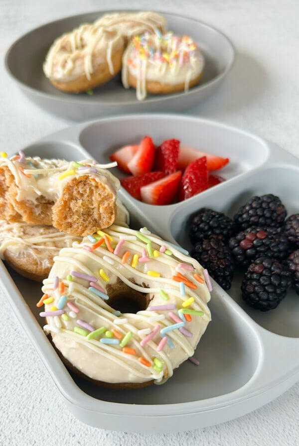 Baked carrot cake donuts served with berries.