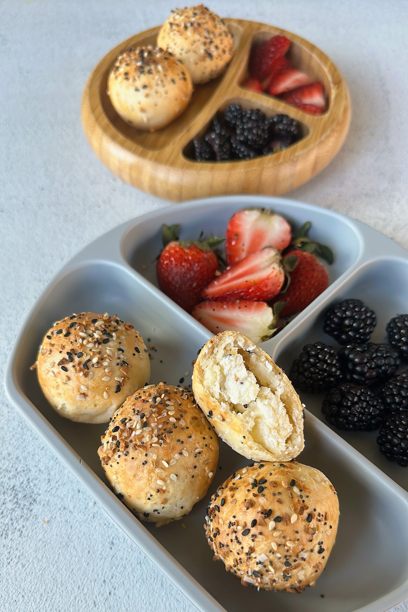 Stuffed everything bagel bites served with berries.