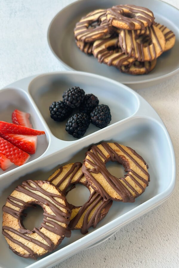 Fudge stripe cookies served with berries.