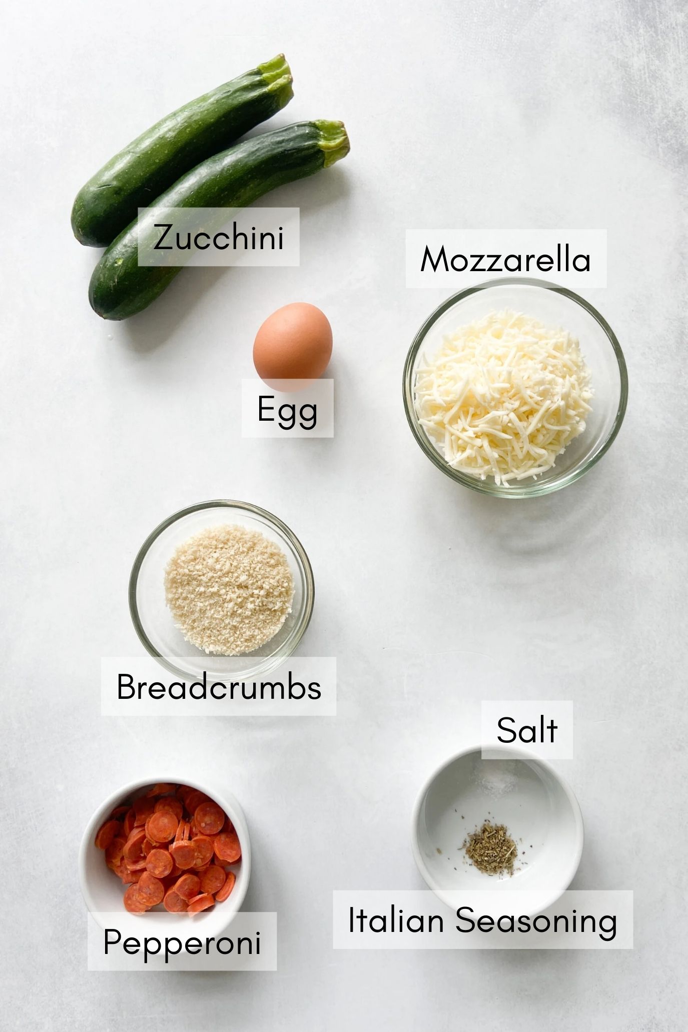 Ingredients to make zucchini pizza bites.