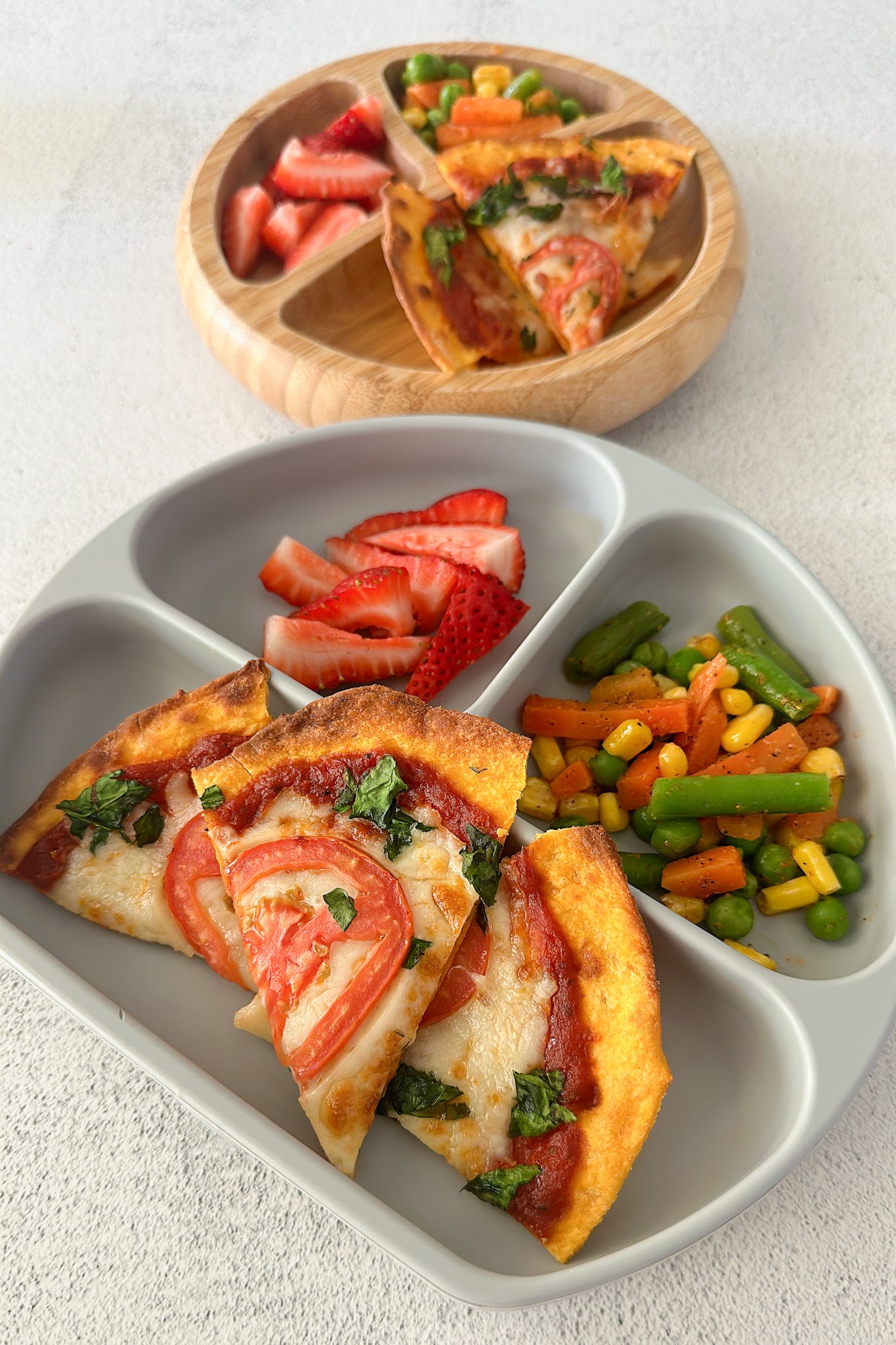 Air fryer tortilla pizza served with strawberries and sautéed veggies.