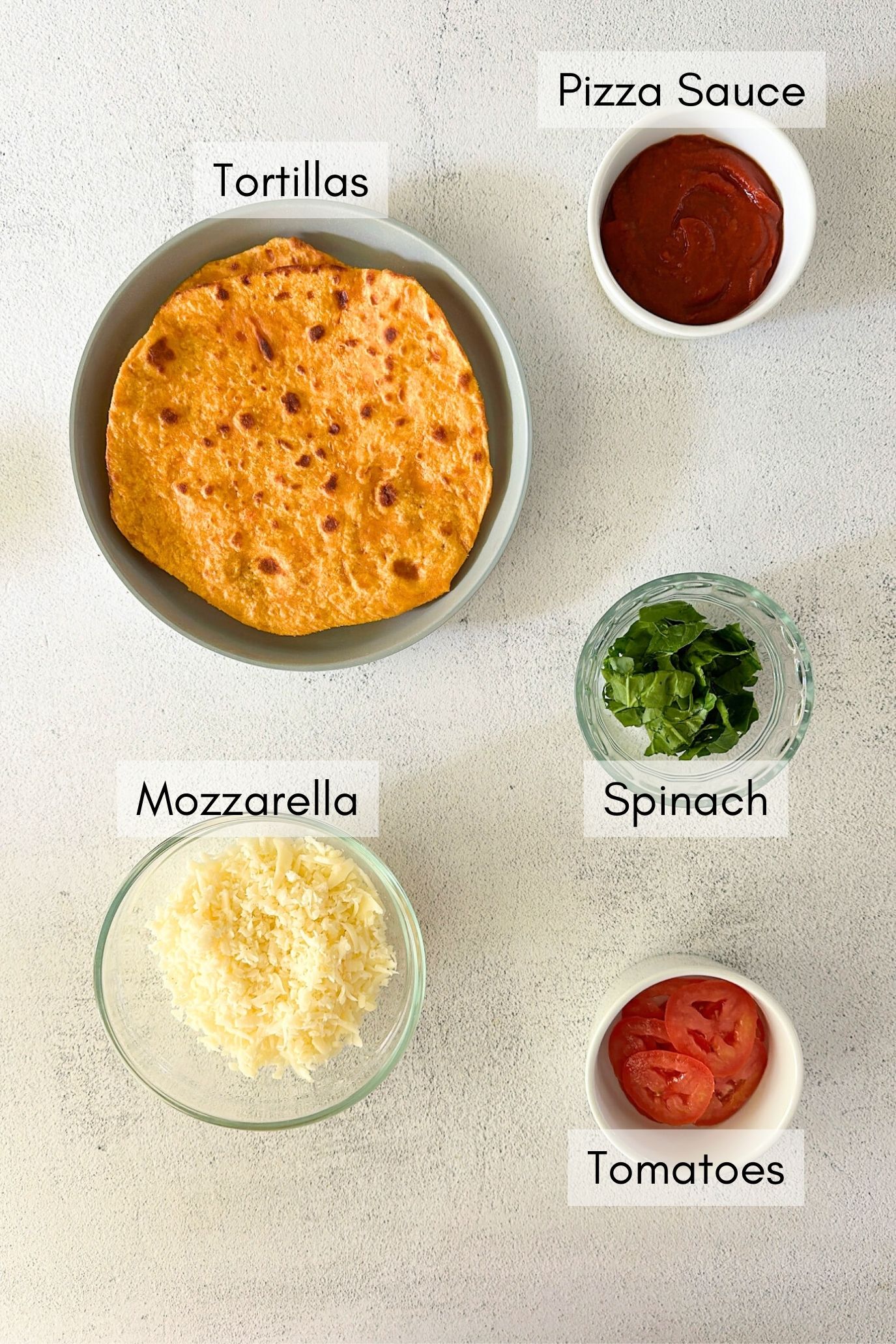 Ingredients to make air fryer tortilla pizza.