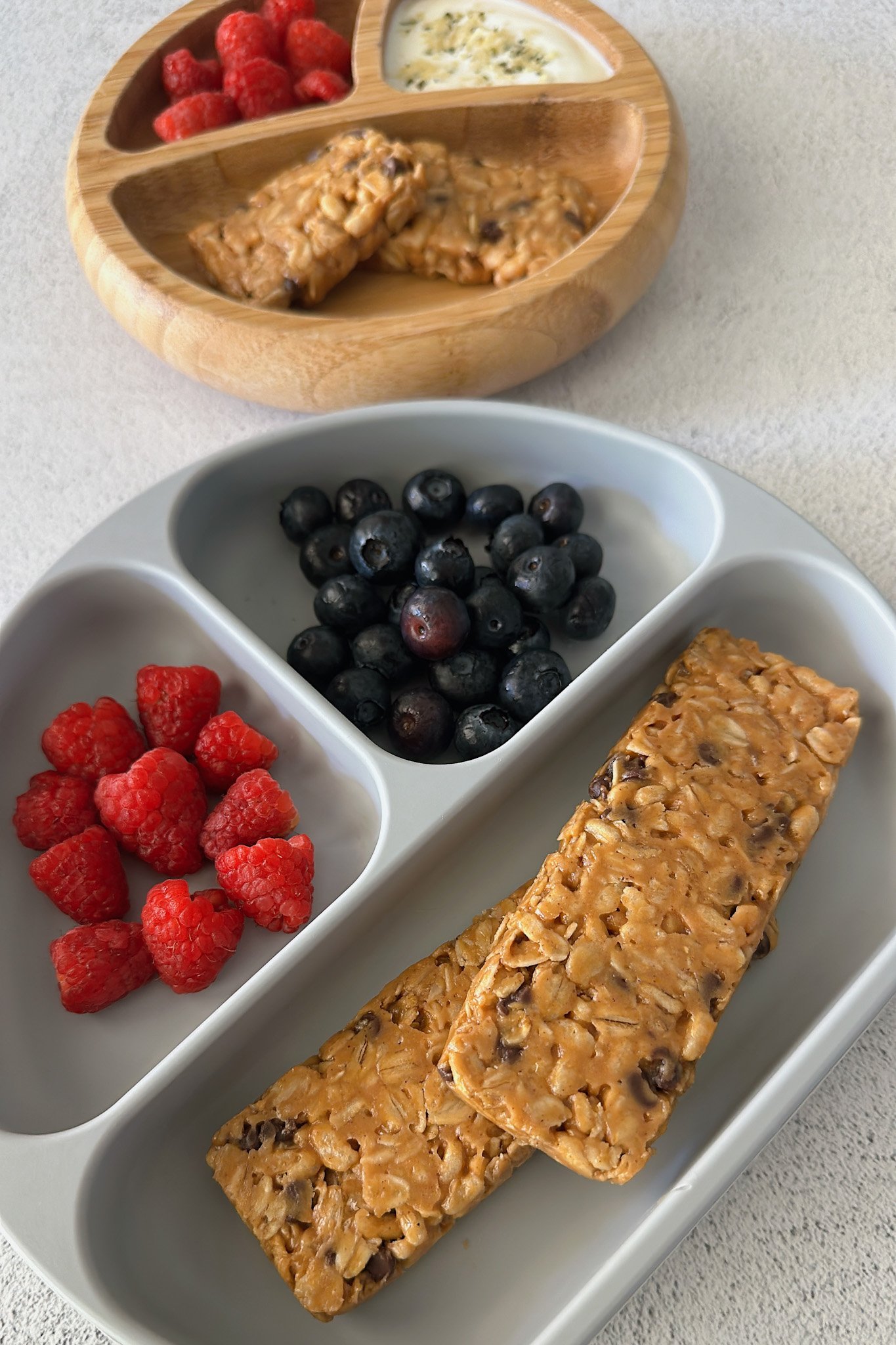 Chocolate chip chewy granola bars served with berries.