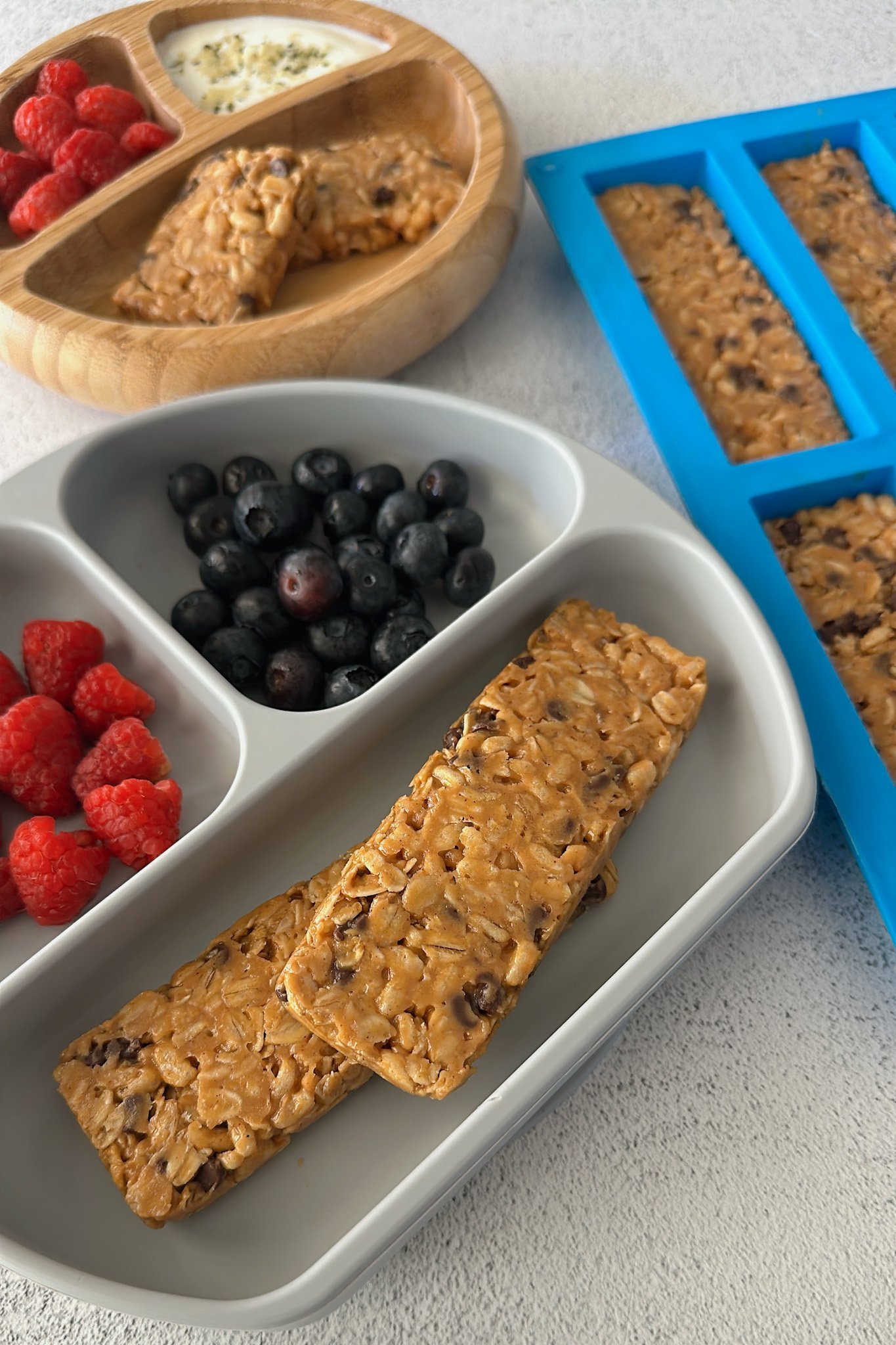 Chocolate chip chewy granola bars served with berries.