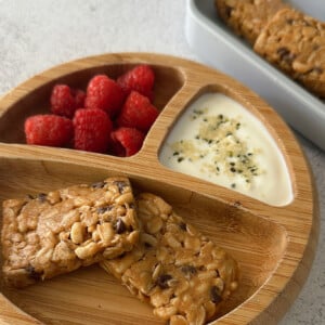 Chocolate chip chewy granola bars served with berries.