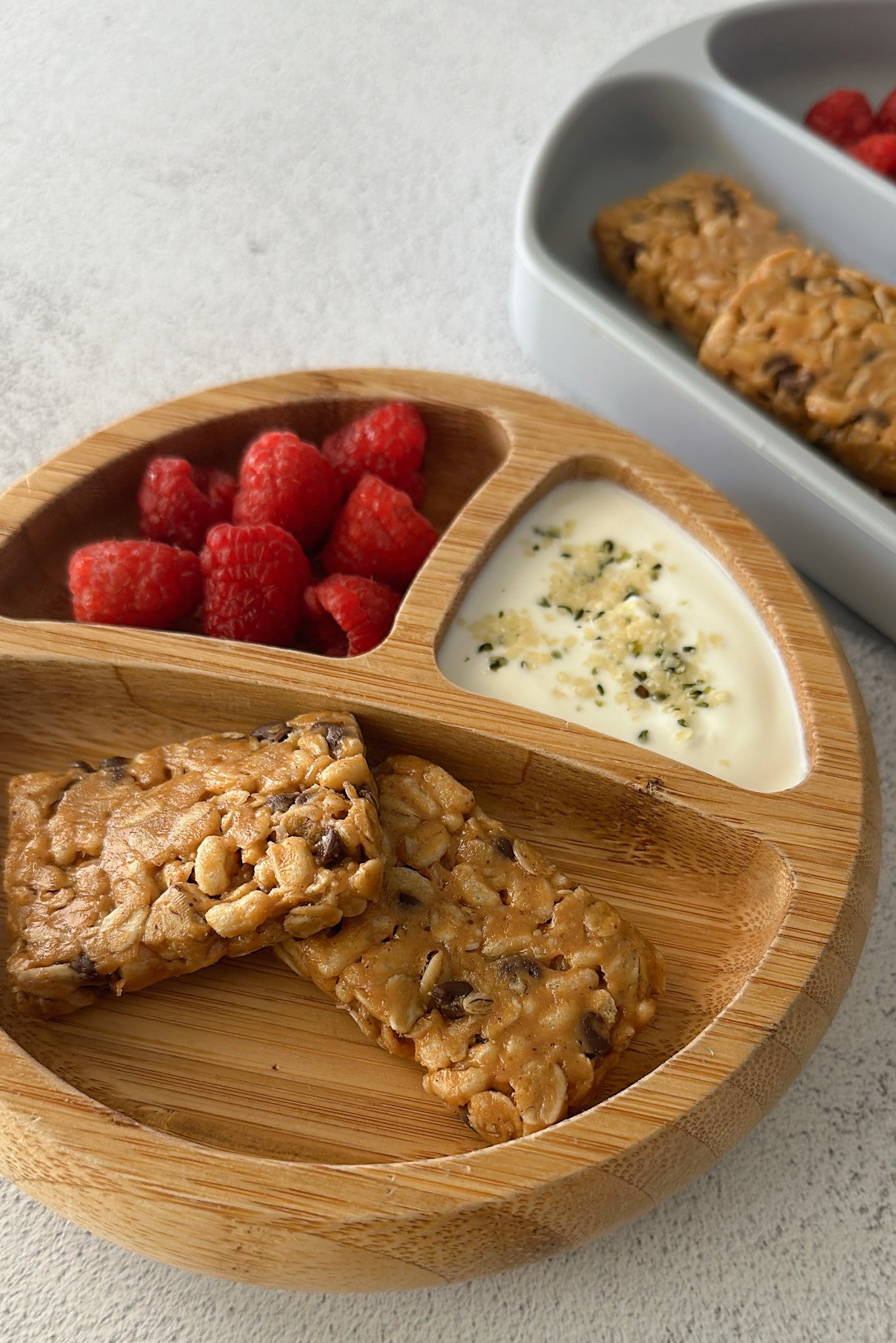 Chocolate chip chewy granola bars served with berries.