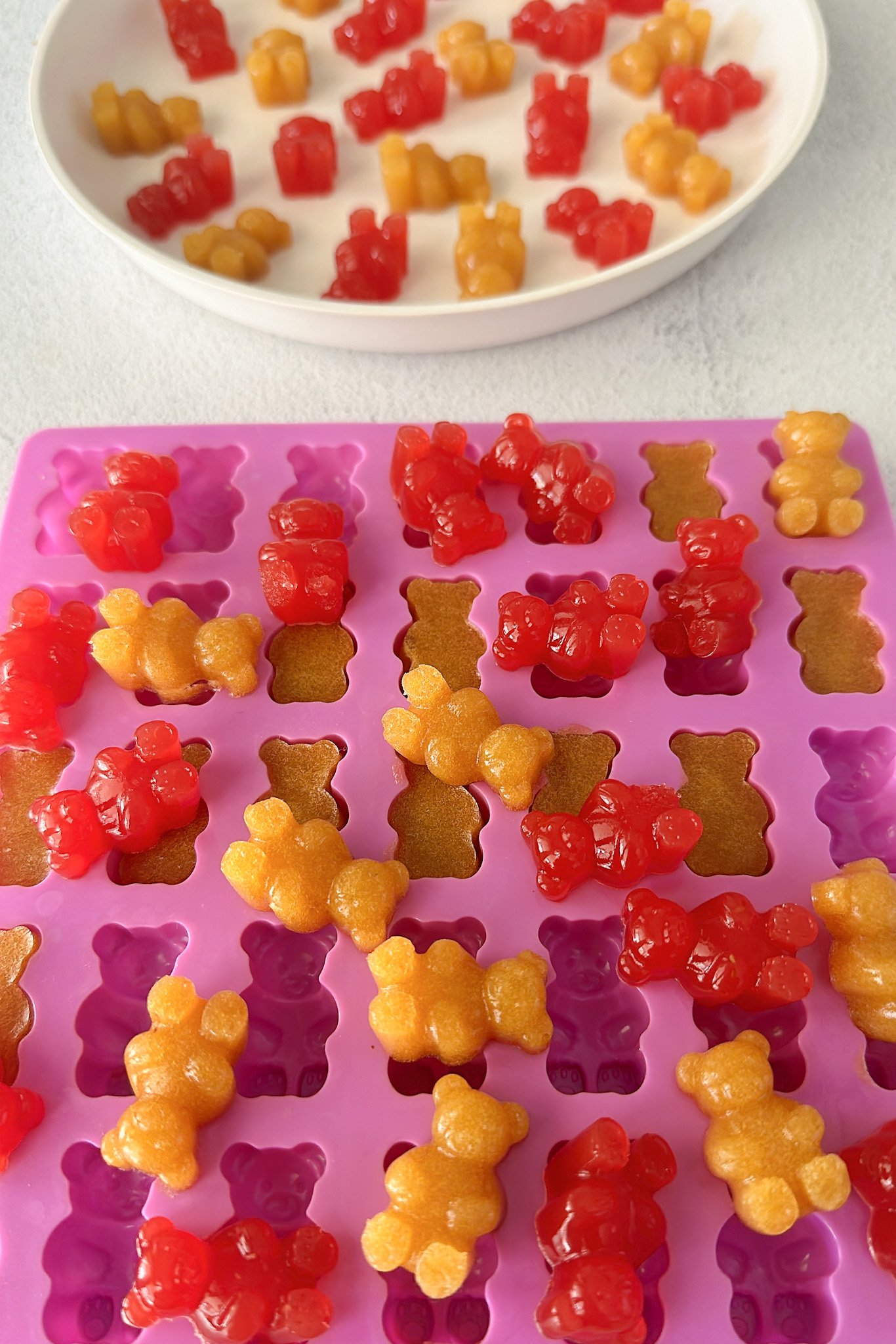 Homemade peach and watermelon gummy bears.