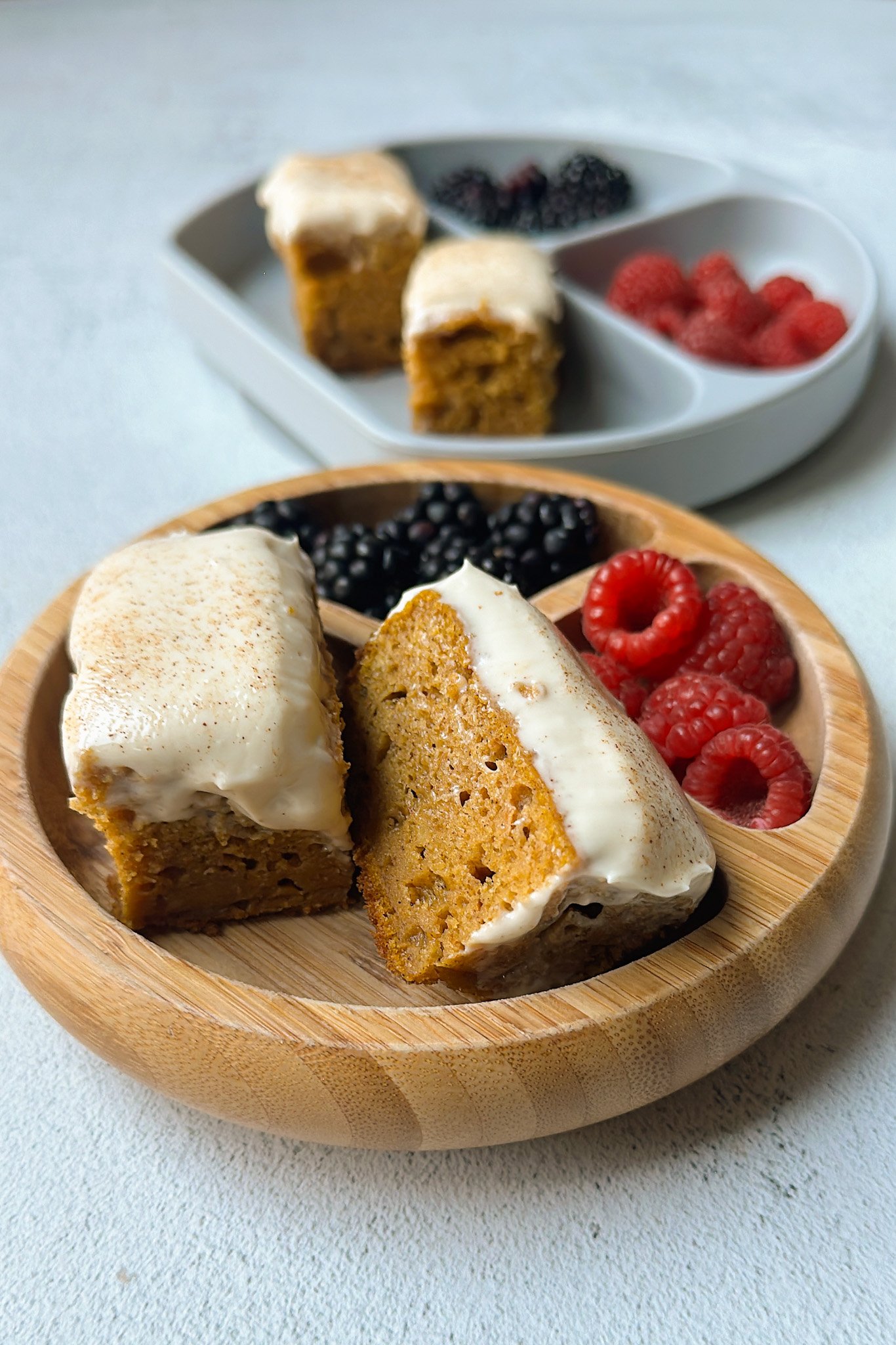 Pumpkin snack cake served with berries.