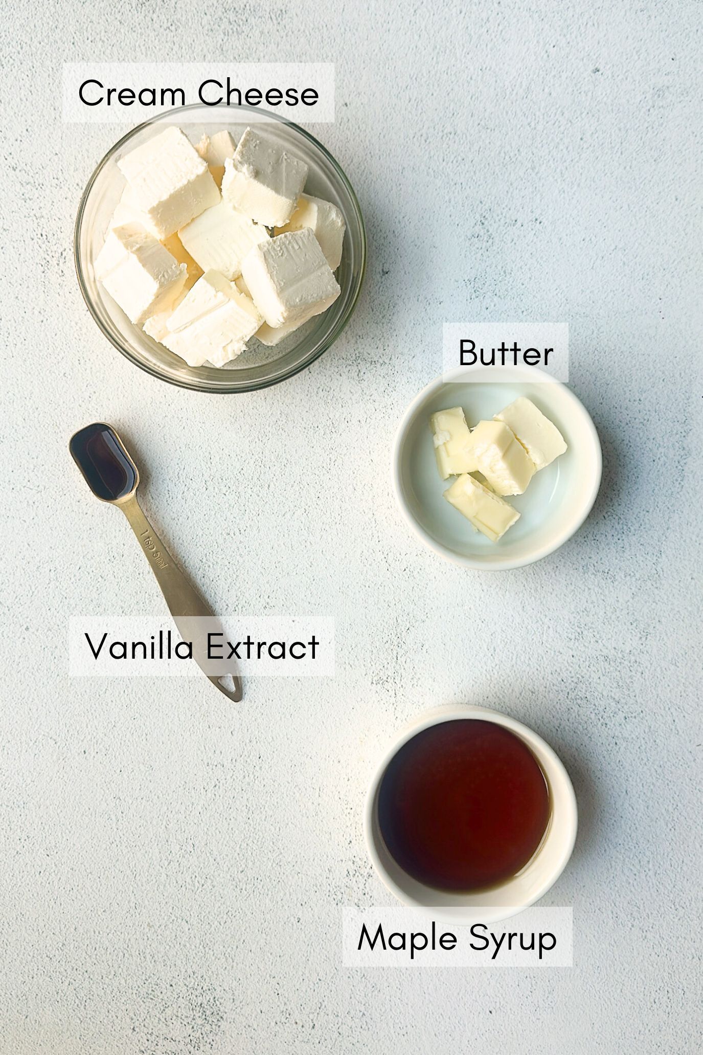 Ingredients to make maple syrup cream cheese frosting.