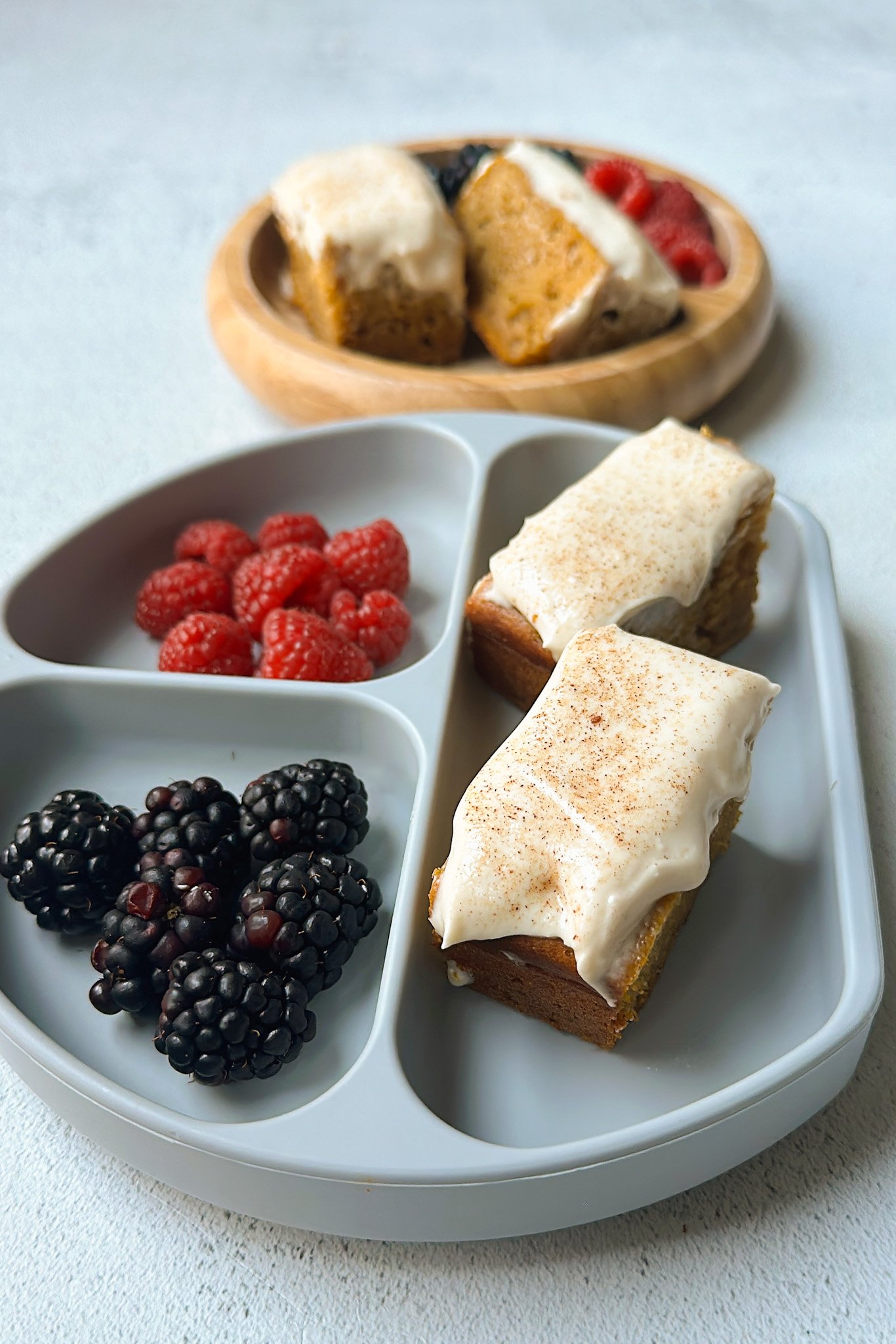 Pumpkin snack cake served with berries.