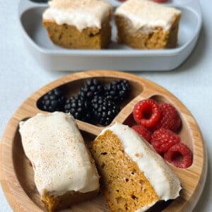 Pumpkin snack cake served with berries.