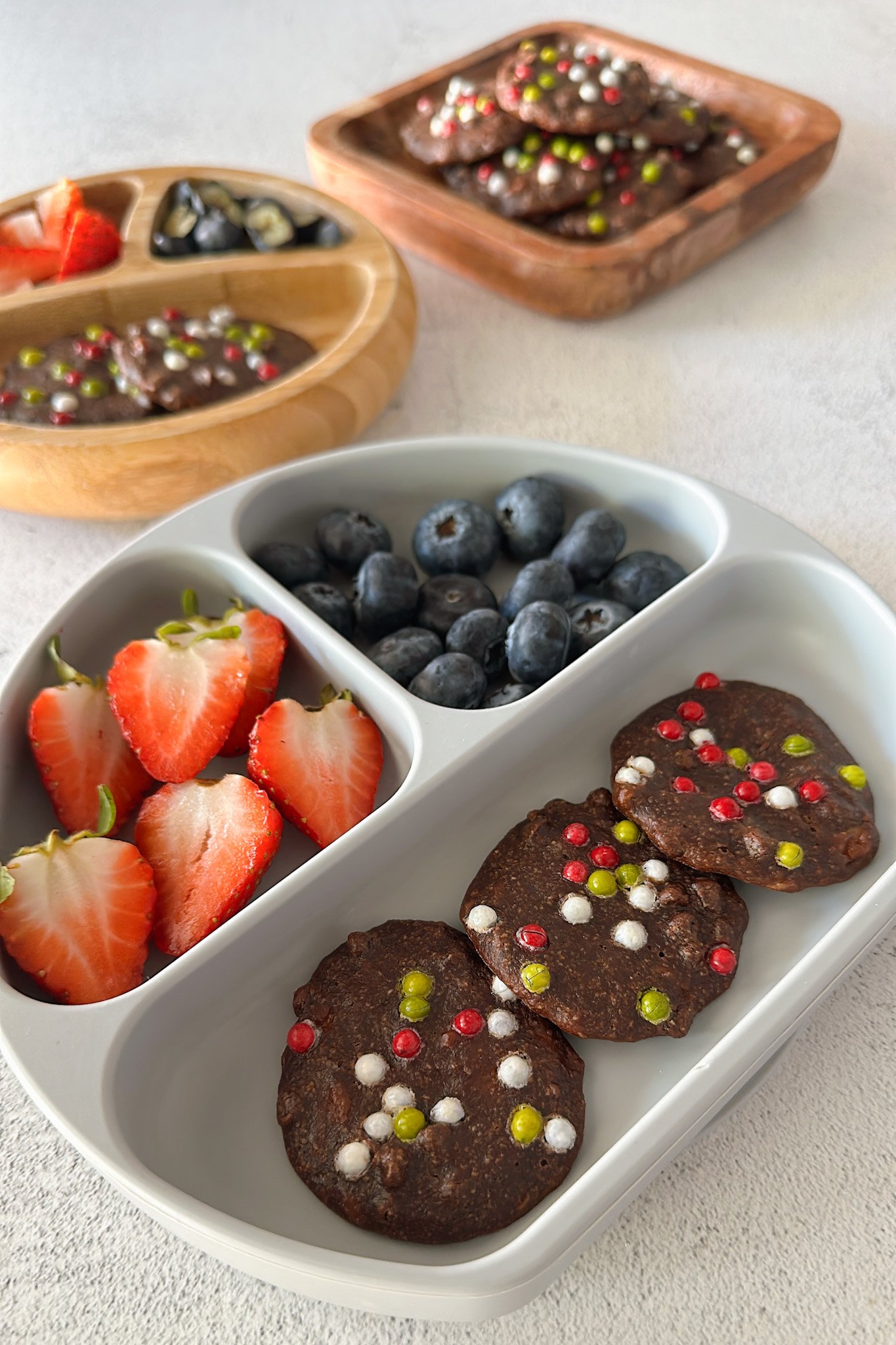 Healthy brownie cookies served with berries.