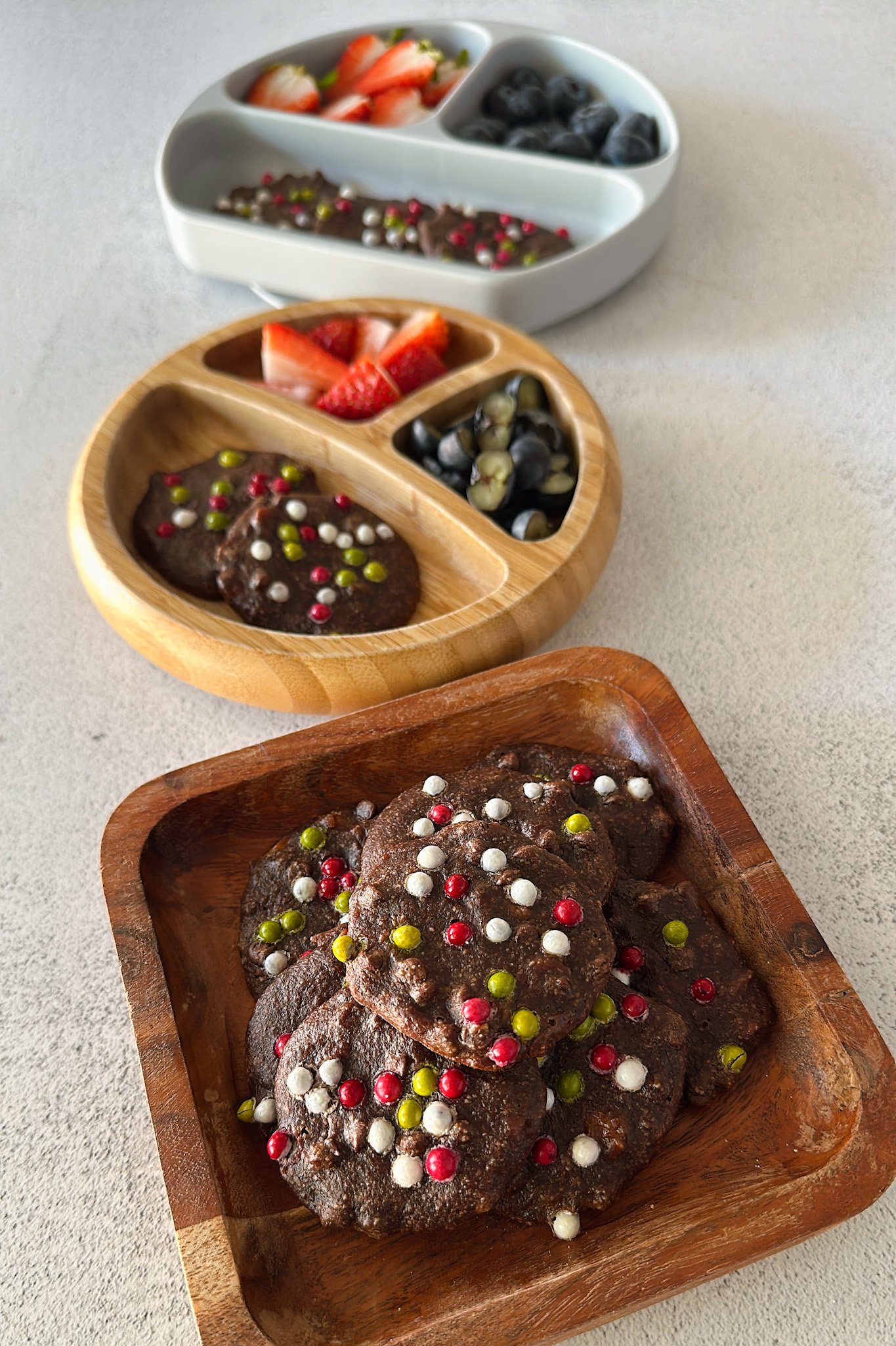 Healthy brownie cookies served with berries.