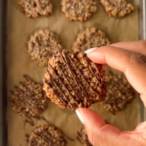 Maple pecan cookies with chocolate drizzled on top.