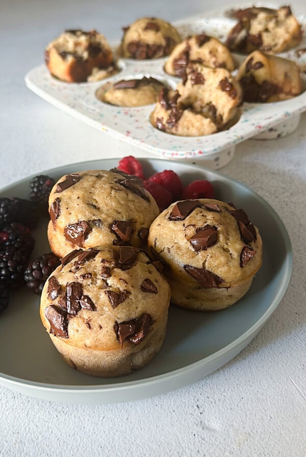 Chocolate chunk banana muffins served with berries.