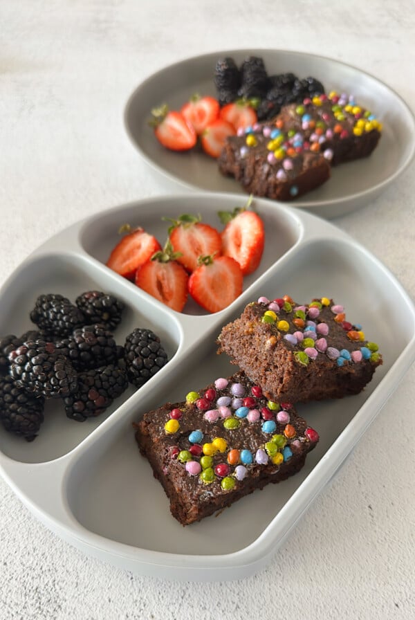 Sweet potato brownies served with berries.