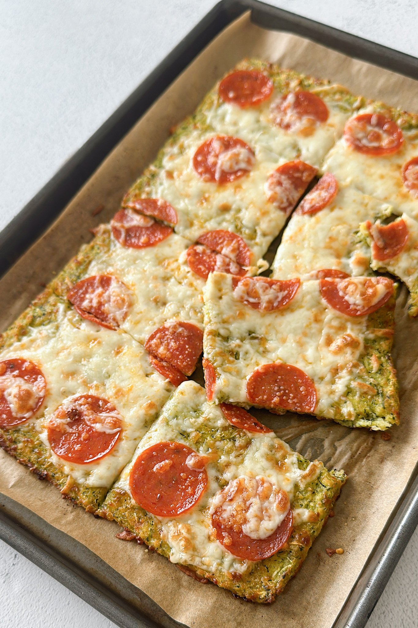 Cheesy zucchini flatbread fresh from oven.