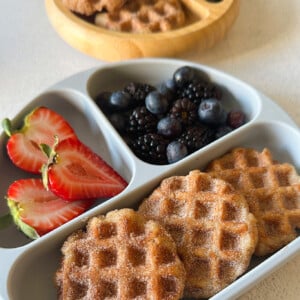 Churro waffles served with berries.